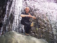 DJ Emir The Monkey King and Mixtape King of Puert Rico In Front of a Waterfall